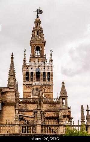 Close up bell tower of cathedral at Seville, Spain. Famous tourism place Stock Photo