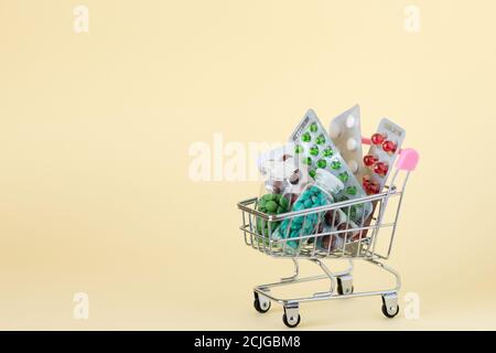 medicines in a shopping cart. The concept of buying medicines on the Internet, online, on the site, remotely Stock Photo