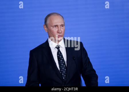 September, 2016 - Vladivostok, Russia - Russian President Vladimir Putin speaks while standing at the blue wall. Close-up. Stock Photo