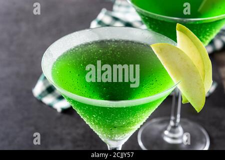 Green appletini cocktail in glass on black background Stock Photo
