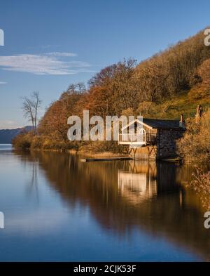 Iconic Duke of Portland Boathouse refection on Ullswater on a cold winters morning. Stock Photo