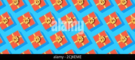 Pattern from gift boxes. Orange present boxes on blue background. Complementary color scheme. Vector 3d illustration. Stock Vector