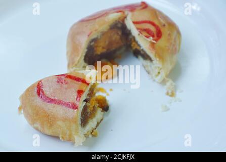 Chinese cake filled mushed winter melon and salty egg cut for pieces on white background Stock Photo