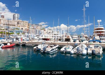Monte Carlo, Monaco - August 15, 2018: Port Hercule view at sunny summer day. Yachts and pleasure boats are moored in marina Stock Photo