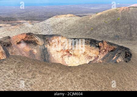 Unique panoramic view of spectacular large volcano crater. Mountains of fire, Timanfaya National Park, Lanzarote, Canary Islands, Spain. Stock Photo