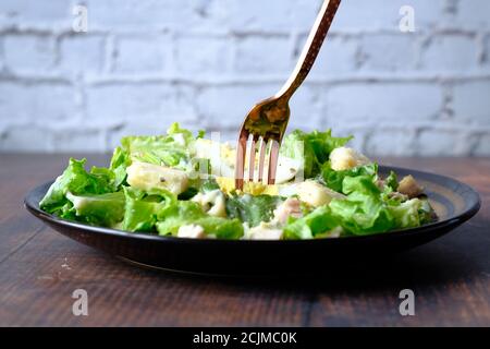 Close up of greek salad in a bowl on table. Stock Photo
