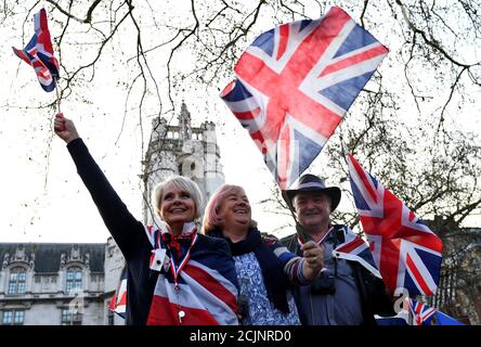 Pro-Brexit protesters wave Union Jack flags outside the Houses of Parliament in London, Britain, March 29, 2019. REUTERS/Dylan Martinez