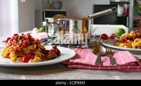 Pasta with meat - mediterranean pasta dinner on a table Stock Photo