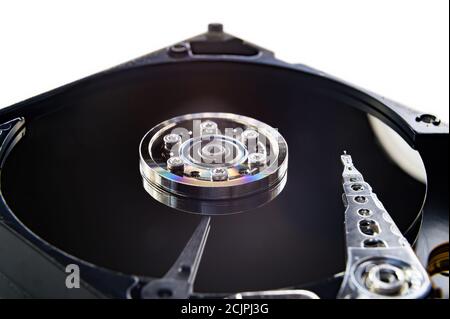 Close-up of an old fashioned, open, mechanical harddisc drive, isolated on a white background Stock Photo