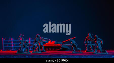 War Concept. Military silhouettes fighting scene  background, World War Soldiers Silhouettes Skyline at night. Attack scene. Armored vehicles. Tanks b Stock Photo