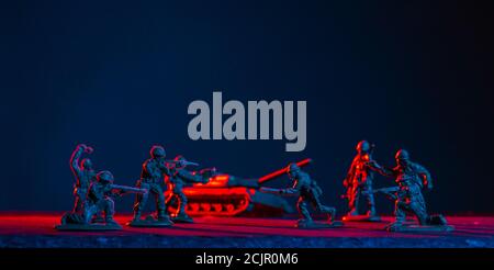 War Concept. Military silhouettes fighting scene  background, World War Soldiers Silhouettes Skyline at night. Attack scene. Armored vehicles. Tanks b Stock Photo