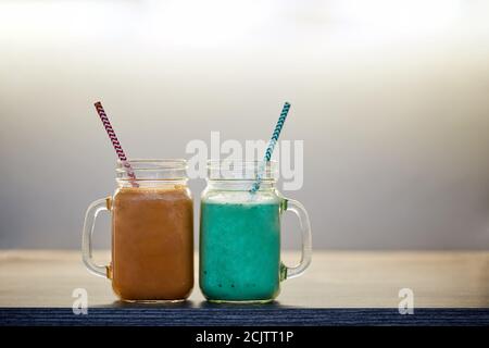 two glasses of exotic cocktails, close up photo. neat juice, home made drink, mixed drink concepts Stock Photo