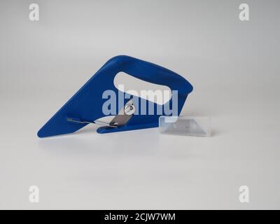 blue carpet cutter, tool isolated on white background Stock Photo - Alamy