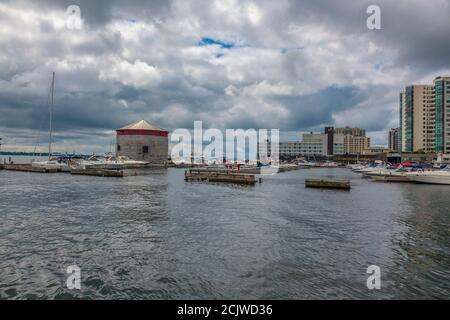 Kingston, Ontario, Canada, August 2014 - The marina and historic stone Martello tower at the waterfront in Kingston Stock Photo