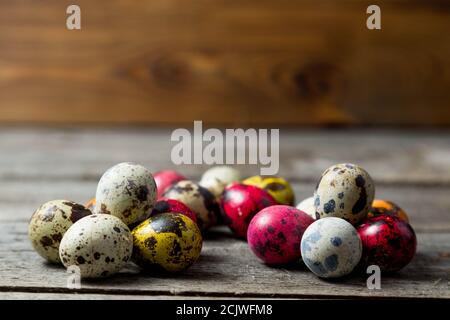 .Painted easter eggs in small groups on wooden background Stock Photo