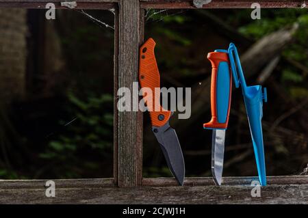 Various knives. Various knives in the window frame. Stock Photo