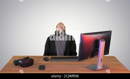 Upset gamer expressing disappointment watching online game on gr Stock Photo