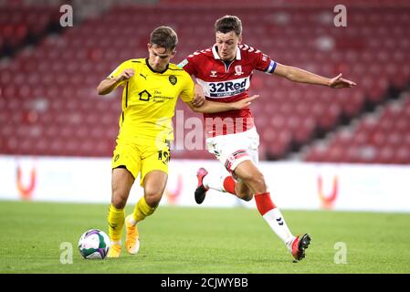 Barnsley's Patrick Schmidt (left) and Middlesbrough's Dael Fry battle for the ball during the Carabao Cup second round match at the Riverside Stadium, Middlesbrough. Stock Photo