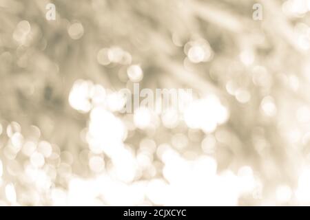 Abstract blurred gold bokeh soft light background and texture. Christmas and Happy new year on blurred bokeh with snowfall banner background. Stock Photo