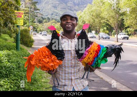 African man selling curios in Cape Town, South Africa Stock Photo