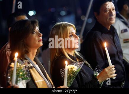 (L to R) Egyptian actors Manal Salama, Nada Basyouni and singer Mohamed El Helo march with candles to the 'Peace Square' during a ceremony to mark the first anniversary of the Russian MetroJet plane crash in the Red Sea resort of Sharm el-Sheikh, south of Cairo, Egypt, October 30, 2016. REUTERS/Amr Abdallah Dalsh