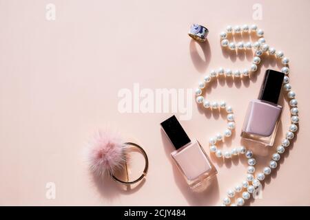 Beautiful flatlay with various fashion accessories, bracelets, rings and earrings, cosmetics, jewelry. shopping ,Beauty and fashion concept.Copy space Stock Photo