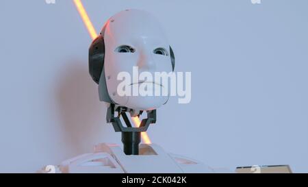White humanoid robot head at technology exhibition. Future and robotic concept Stock Photo
