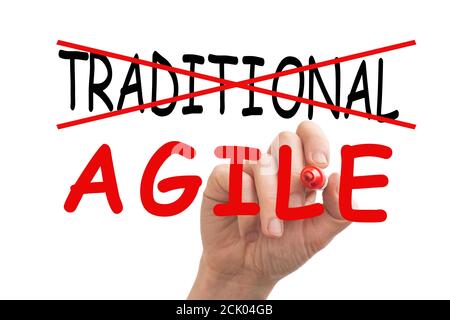 Male hand erasing the word Traditional and replacing it with the word Agile Stock Photo
