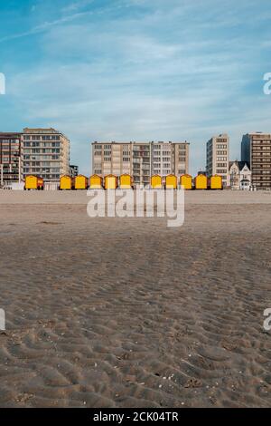 Vintage beach huts on the Belgian coast at sunset Stock Photo