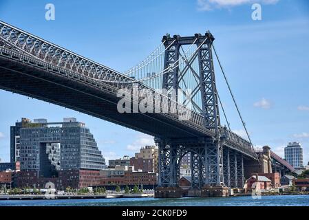 BROOKLYN, NY - SEPTEMBER 7 2020: The Williamsburg Bridge spans the East River from the Lower East Side of Manhattan to Brooklyn, NY. This view show th Stock Photo