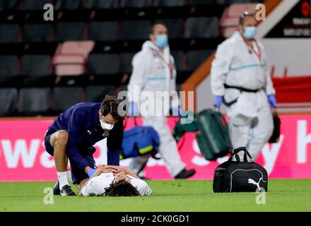 Crystal Palace's Nya Kirby (floor) receives medical treatment after going down injured during the Carabao Cup match at the Vitality Stadium, Bournemouth. Stock Photo