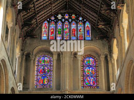 Ely Cathedral, interior, South Transept, Norman arches below, Early English arches above, Victorian stained glass, windows, Cambridgeshire, England Stock Photo