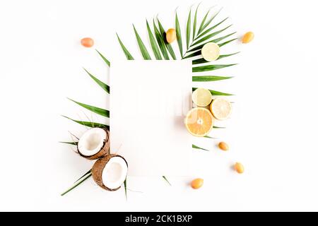 Creative layout made of paper and summer tropical fruits on white background. Food concept. flat lay, top view Stock Photo