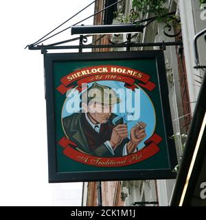 London, UK - May 06, 2012: English pub sign, Public house, known as pub, is focal point of community. Pub business, now about 53,500 pubs in UK, has b Stock Photo