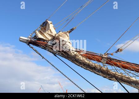Sailing ship mast against the blue sky on some sailing boats with rigging details Stock Photo