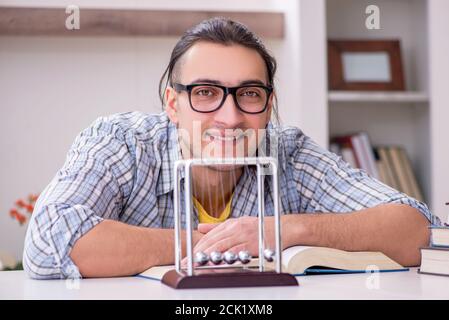 Male student preparing for exam at home Stock Photo