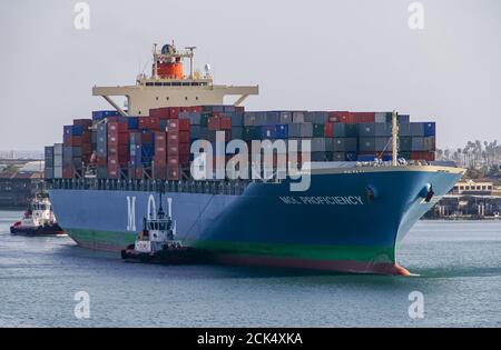 Los Angeles, USA - April 20, 2008: San Pedro harbor. Blue MOL Proficiency container ship on the move in channel, fully loaded with red and blue boxes. Stock Photo