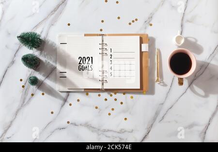 New Year Resolution Goal List 2020 - Business office desk with notebook about plan listing of new year goals and resolutions setting. Change and Stock Photo