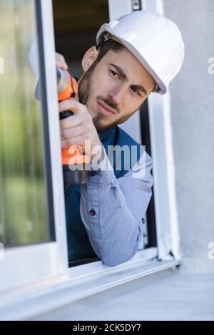 construction worker sets of metal and plastic window Stock Photo