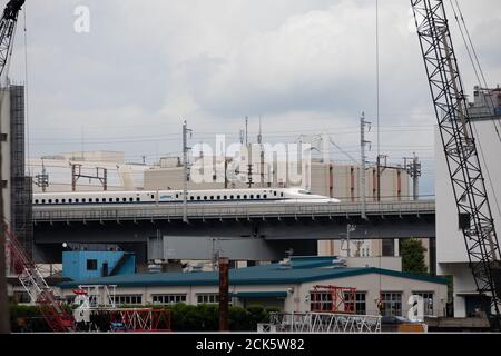 TOKYO, JAPAN - September 15, 2020 :  Shinkansen moving across industrial area in Shinagawa. Stock Photo