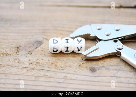 diy tools concept / Working tools with Straight Jaw Locking Pliers and DIY on wooden Stock Photo