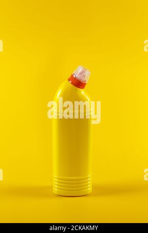 Bottle with detergent on a yellow background, space for text Stock Photo
