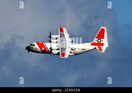 An Air Station Barbers Point HC-130 Hercules airplane crew conducts joint operations with the Coast Guard Cutter Kimball (WMSL 756) in the Pacific, August 6, 2020. The crews were participating in the multi-country maritime Operation Nasse designed to prevent Illegal, unregulated or unreported (IUU) fishing in Oceania. (U.S. Coast Guard photo courtesy of the Coast Guard Cutter Kimball/Released) Stock Photo