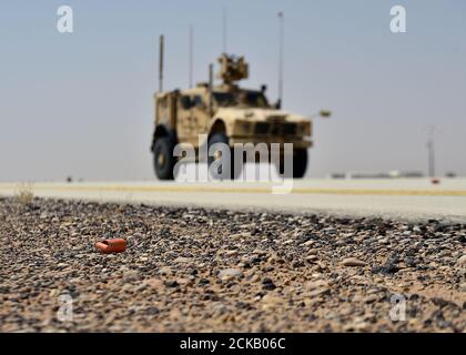 Members of the 378th Expeditionary Civil Engineer Squadron explosive ordnance disposal section perform a training scenario at Prince Sultan Air Base, Kingdom of Saudi Arabia, Sept. 4, 2020. This exercise scenario helps EOD Airmen coordinate with engineering assistants to discover unexploded ordnances and assess flightline damage after an attack. (U.S. Air Force photo by Staff Sgt. Cary Smith) Stock Photo