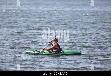 Heacham, UK. 14th Sep, 2020. A fishing boat working on the calm sea on ...