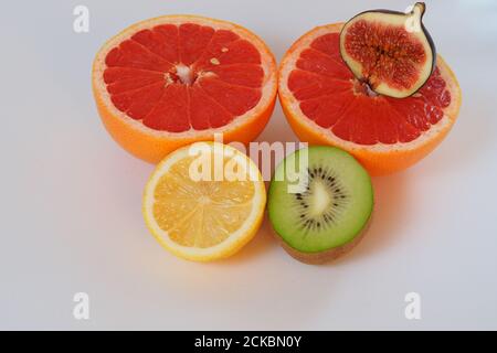 Citrus and exotic fruits cut in half. Stock Photo