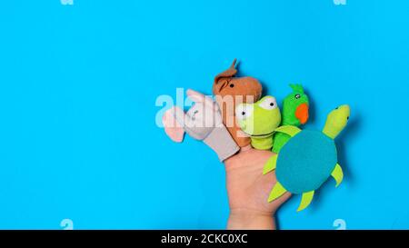 Small children's hand and finger toys animals: elephant, deer, frog. parrot and turtle. Fingers Theatre. Stock Photo