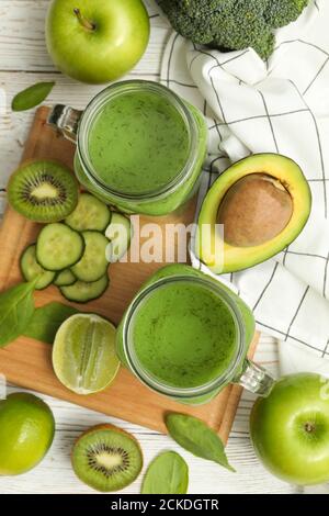 Concept of healthy food with smoothie, vegetables and fruits on wooden table Stock Photo