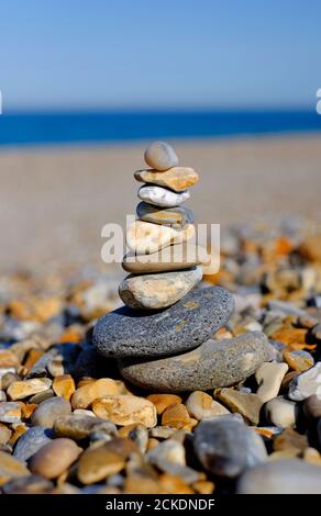 pile of balanced pebbles on cley beach, north norfolk, england Stock Photo