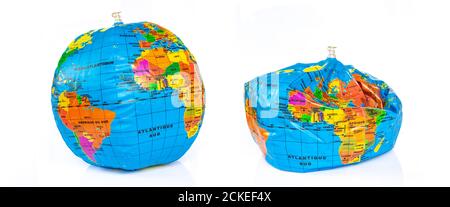 Planet earth toy balloon inflated and deflated isolated on white background. Earth overshoot day, unsustainable resources consumption concept Stock Photo